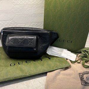 Gucci embossed bumbag with original box, dust bag, and shopping bag, and tags.